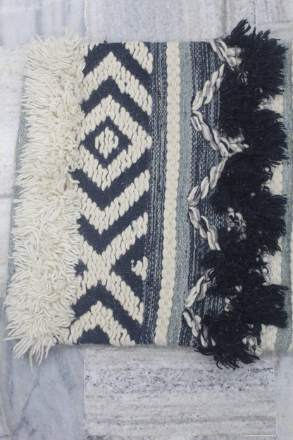GEOMETRICAL DESIGN CUSHION COVER WITH EXTRA KNOTS AT EDGES