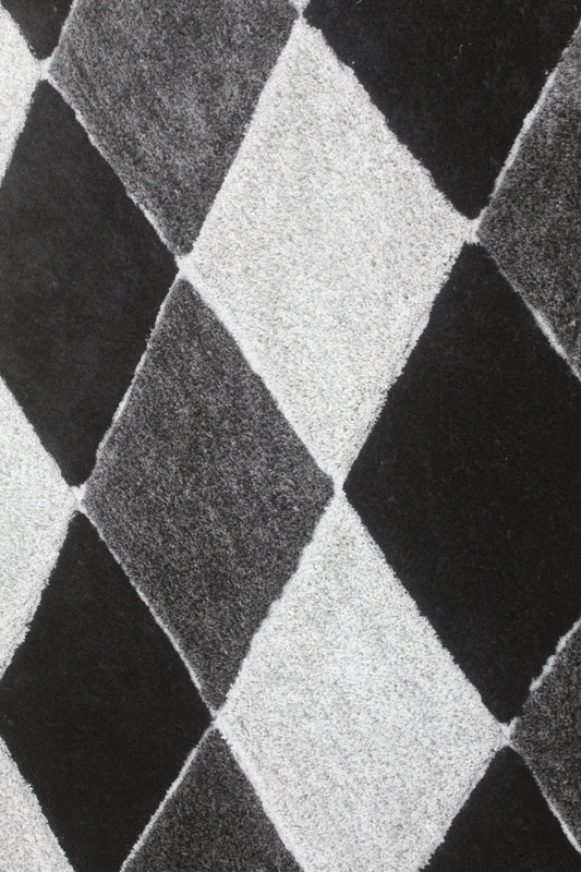 Shaggy diamond rug in black & grey. Soft, plush, and modern with a bold geometric design – perfect for living rooms, bedrooms, or offices.