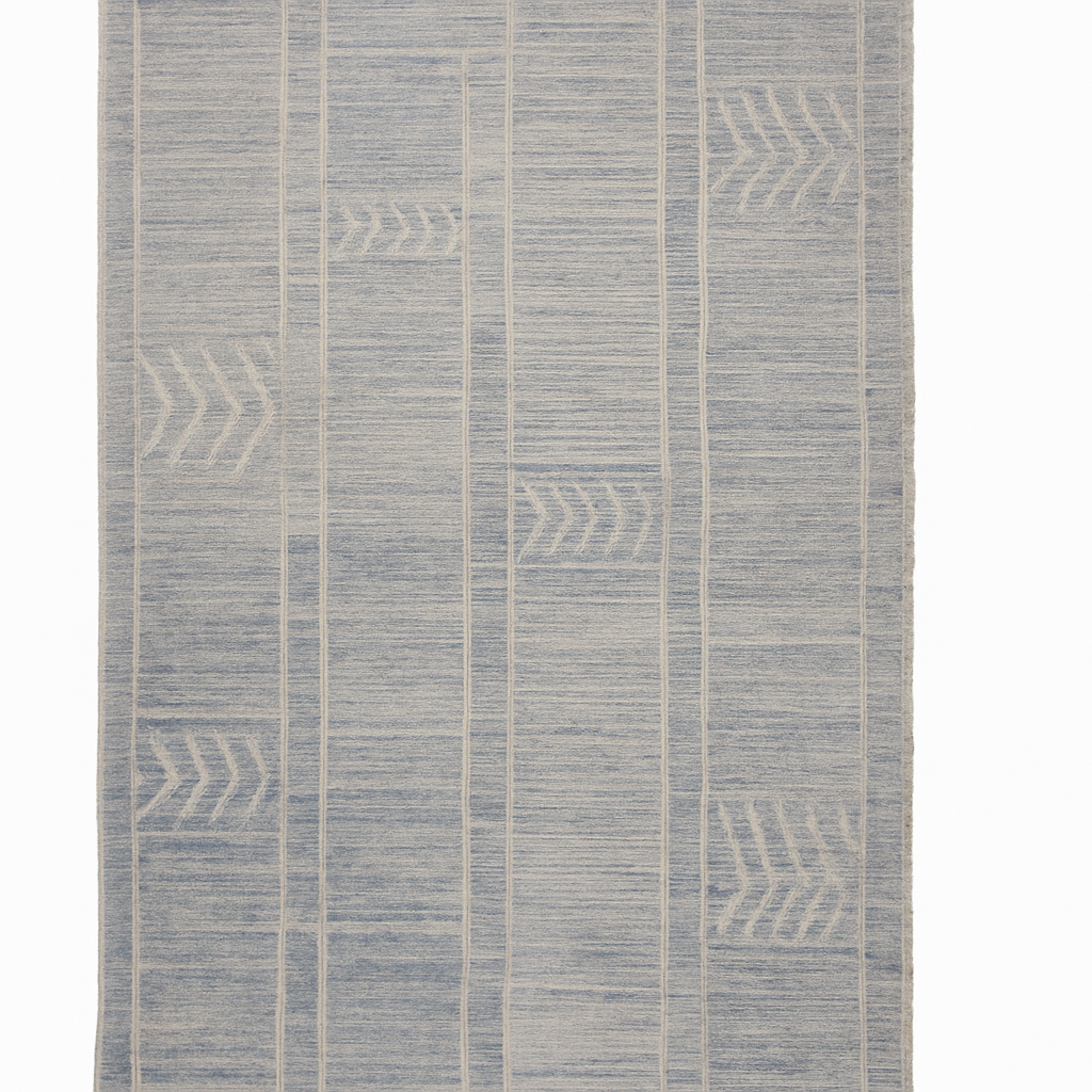 Textured blue and beige patterned rug on a white background